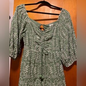 Green patterned maxi dress. Open back with tie.